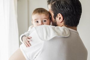 aptaclub united with new parents father holding baby