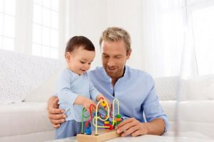 father and baby playing