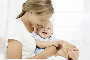 mother holding baby