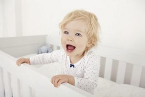 toddler in cot
