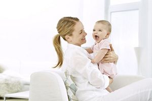 mother laughing with baby