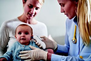 doctor examining baby