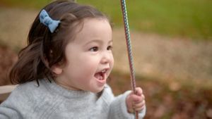 Baby Girl On Swings