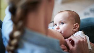 Baby Looking At Mum While Breastfeeding