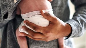 Dad Holding Newborn Baby