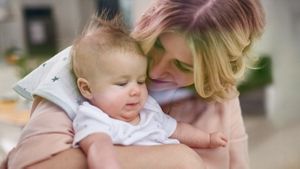 Mother Holding Newborn