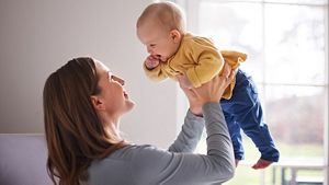 Mother Holding Up Baby