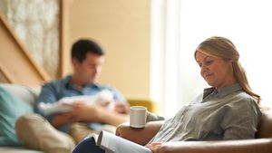 Mum Relaxing With Magazine