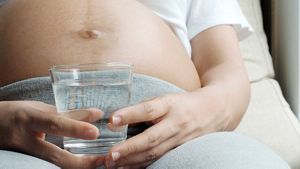 Mum To Be Holding Glass Of Water