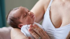 Newborn In Mums Arms