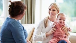 Smiling Mother With Baby
