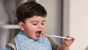 Toddler Eating From Spoon