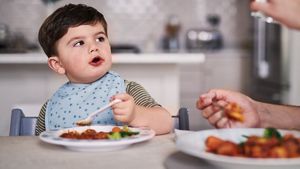 Toddler Having Dinner