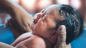 Baby-in-hands-water-birth
