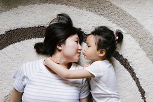 Adorable Little Girl With Her Mother