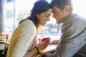 couple-holding-hands-cafe