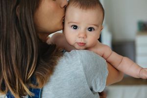 cute-baby-held-mum