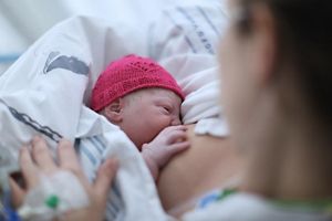 baby-pink-hat-breastfeeding