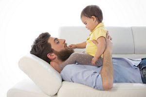 daddy and his daughter lying on the sofa, father-laying-bank-girl