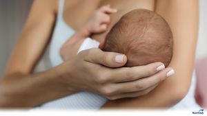 Mom-breastfeeding-baby-holding-his-head