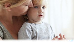 Mother-talking-to-blonde-toddler