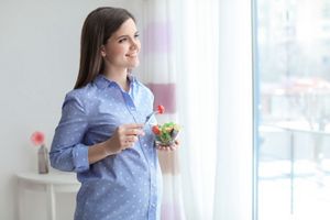pregnant-eating-salad-window.jpg