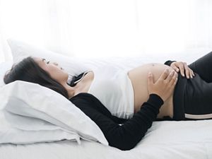 pregnant-lie-bed.jpg