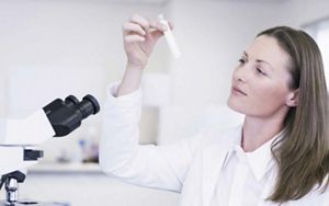 Woman with testtube